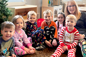 Appleton Child Care - Amy & Children in Christmas PJs