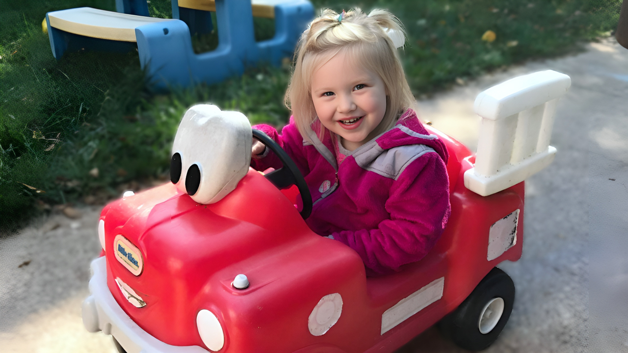 Arrival and Departure - Girl in a Play Car