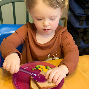 Child Care Nutrition - Girl Eating Lunch