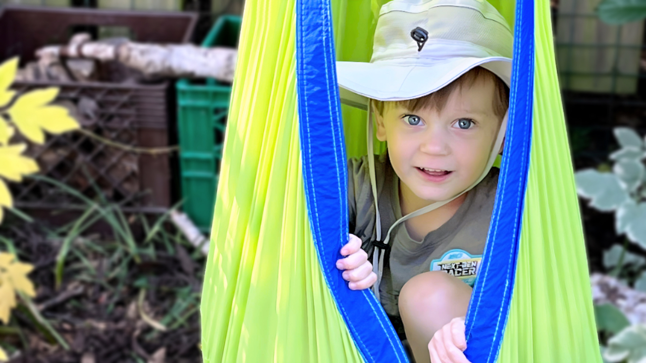 Child Care Policies - Boy in Hanging Nook Outdoors