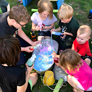 Family Child Care Program - Children Playing in Colored Bubbles