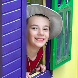 Arrival & Departure - Boy Peeking Out from Play House Window