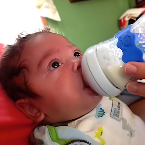 Breastfeeding Support - Infant Drinking a Bottle