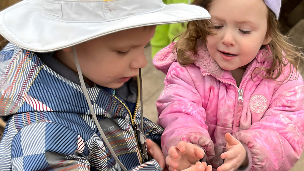 Child Care App - Children Holding a Worm