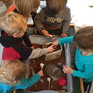 Child Care Daily Schedule - Children in Sensory Table