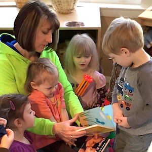 Child Care Daily Schedule - Boy and Girl Reading Books