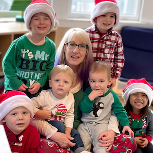 Child Care Policies - Amy with Children in Santa Hats