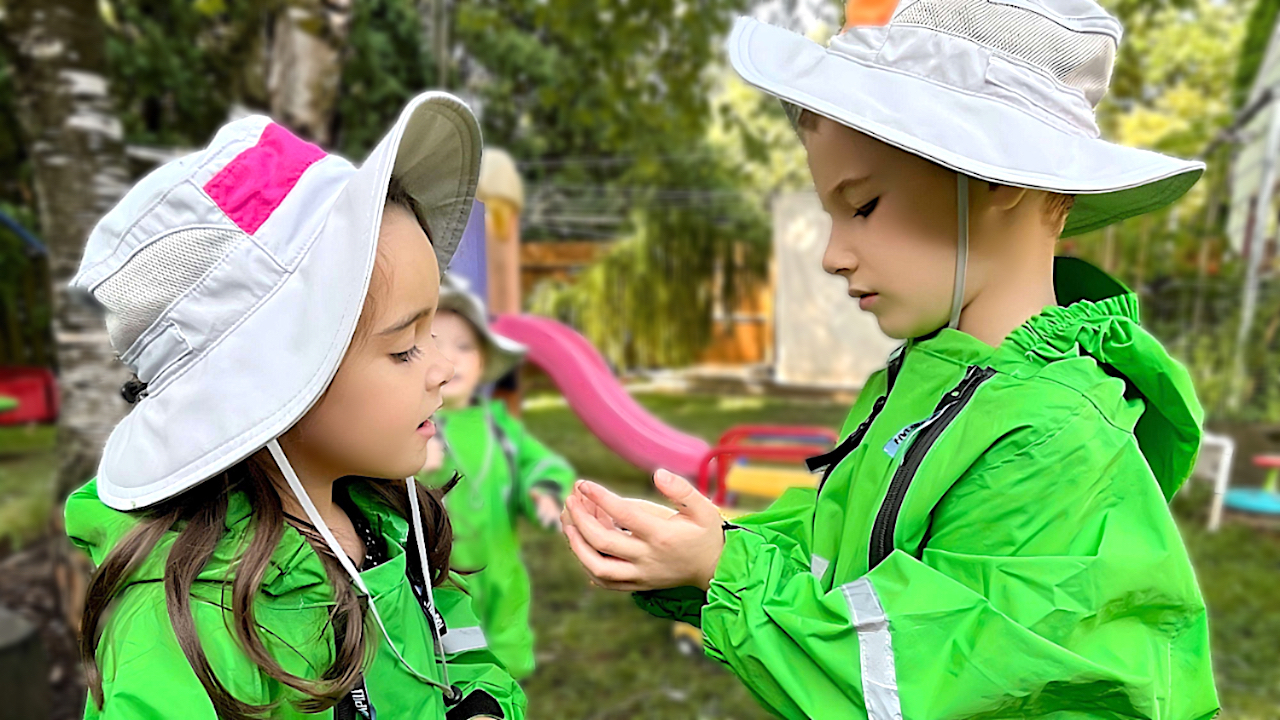 Child Care Prices - Children in Green Rain Suits