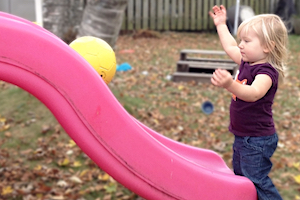 Child Care Safety - Girl rolling a ball