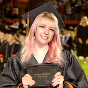 Graduate celebrating after the ceremony