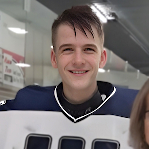 A teen athlete wearing hockey jersey