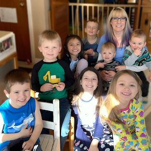Child Care Waiting List - Amy with Group of Children