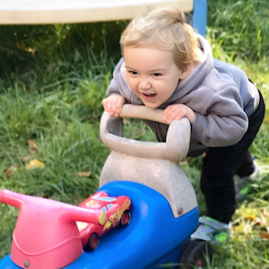 Child Care Wellness Policies - Boy Running and Pushing a Bike