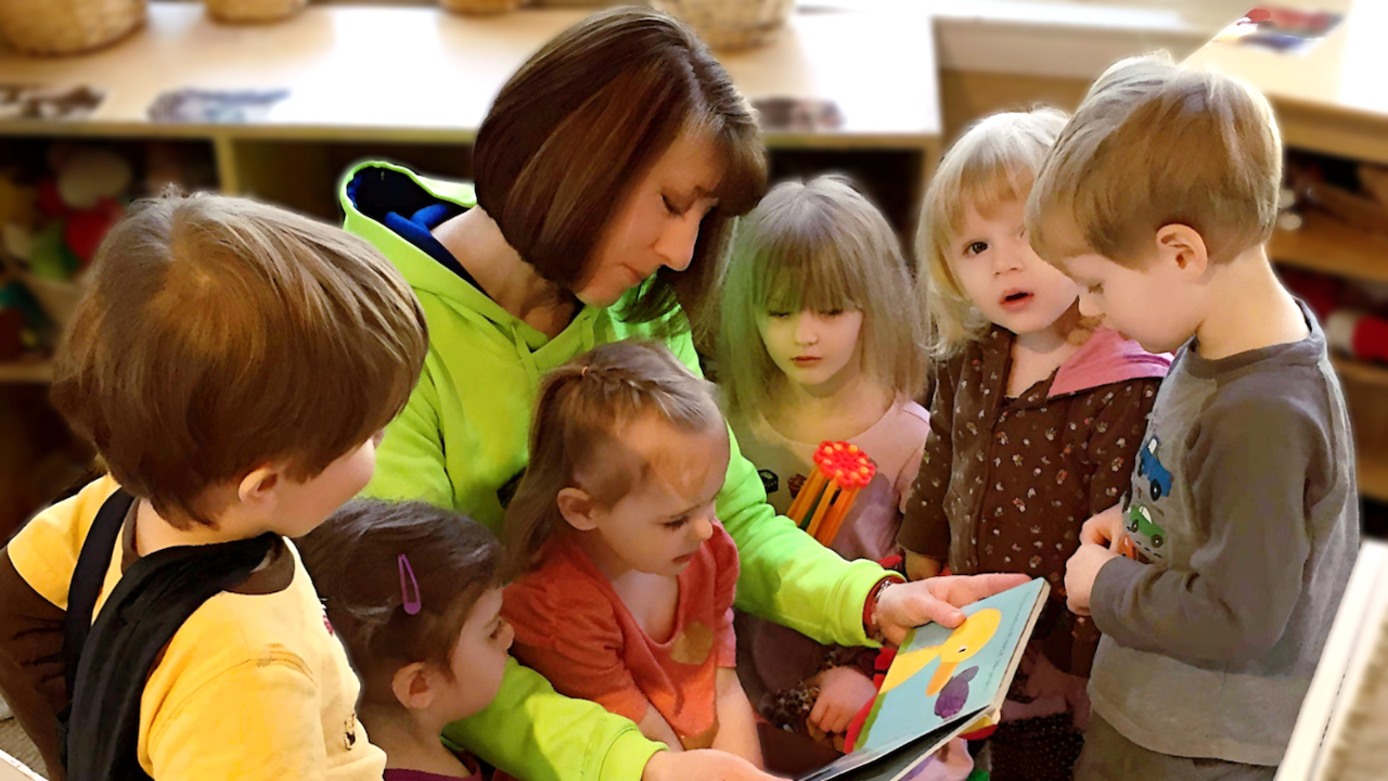 First Day of Childcare - Amy Reading to Children