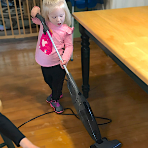 Green Child Care - Girl Vacuuming