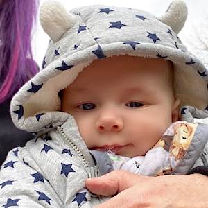 Infant and Toddler Care - Baby in Winter Gear on Amy's Lap