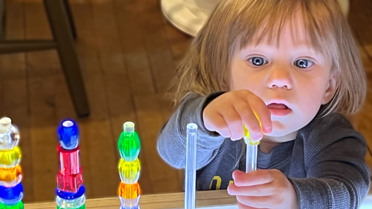 Infant and Toddler Child Care - Toddler Playing with Light Table