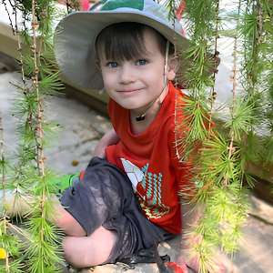 Nature Based Learning - Boy Sitting Under Tree