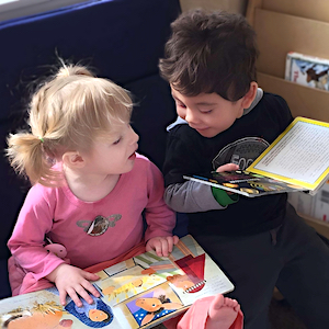 Girl and Boy Laughing with Books